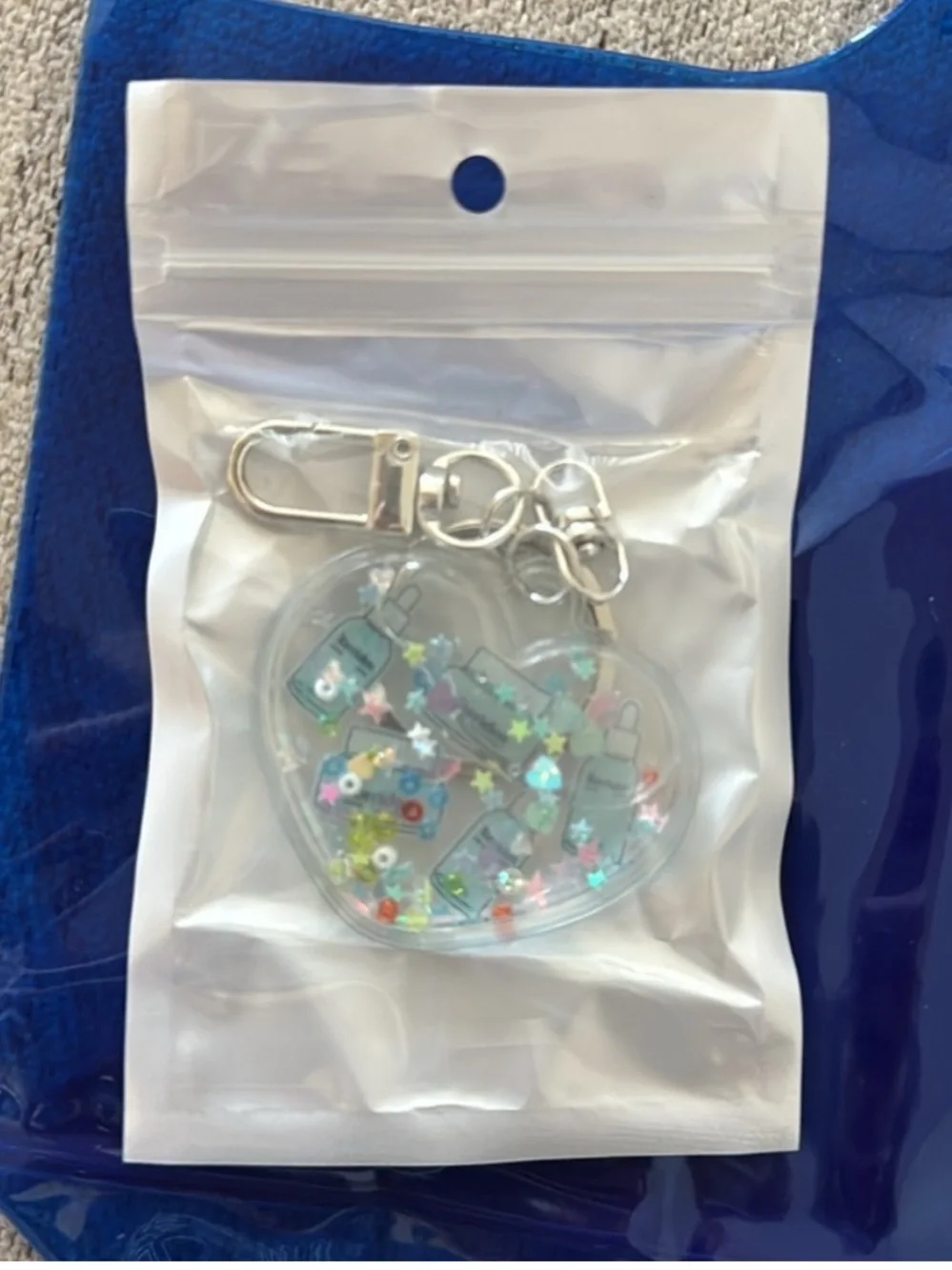 Torriden Heart Keychain with Glittery skincare charms inside